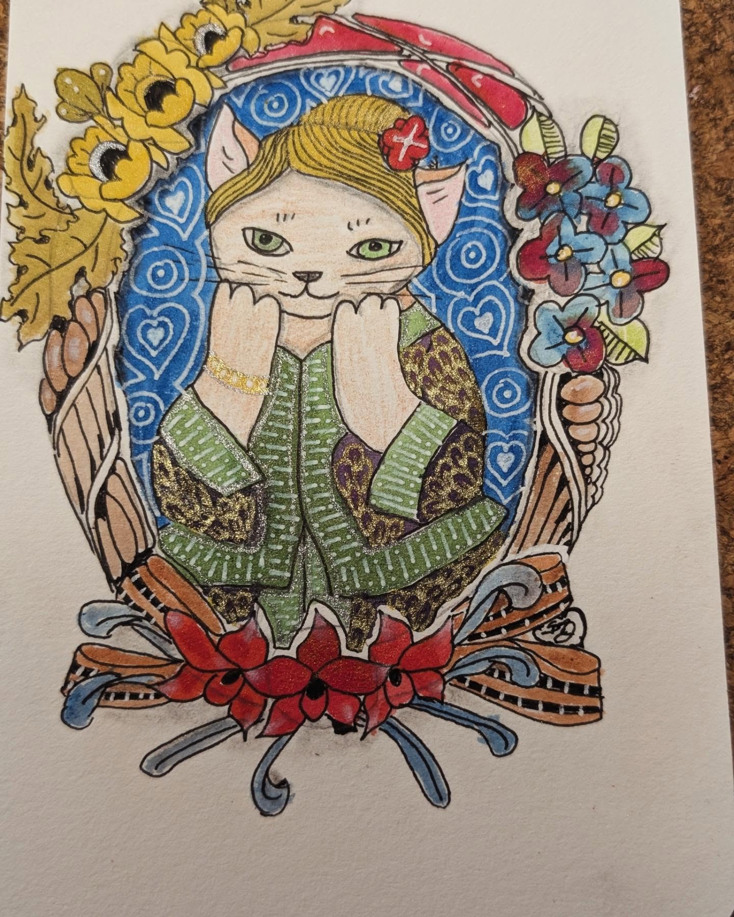 Hand-drawn colourful cat resting inside a tangled wreath of leaves and flowers